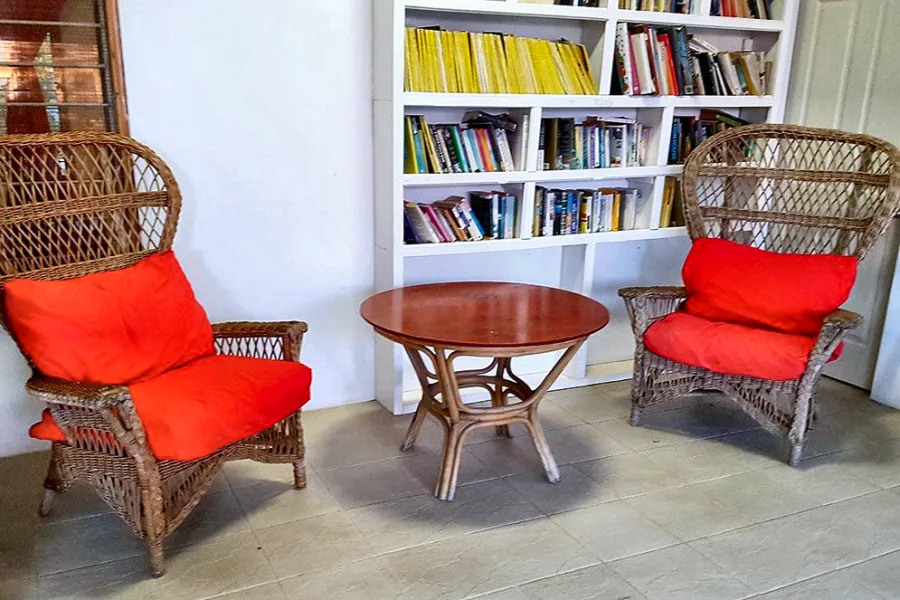 The lounge of the Back Apartment, with louvre windows onto the garden