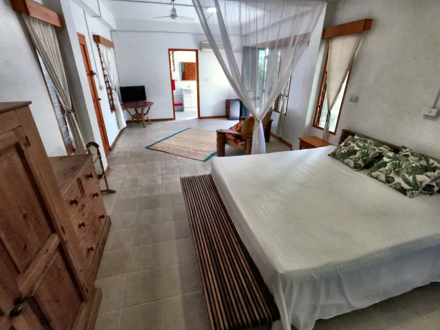 The sleeping area of the Back Apartment, behind the curtain screen