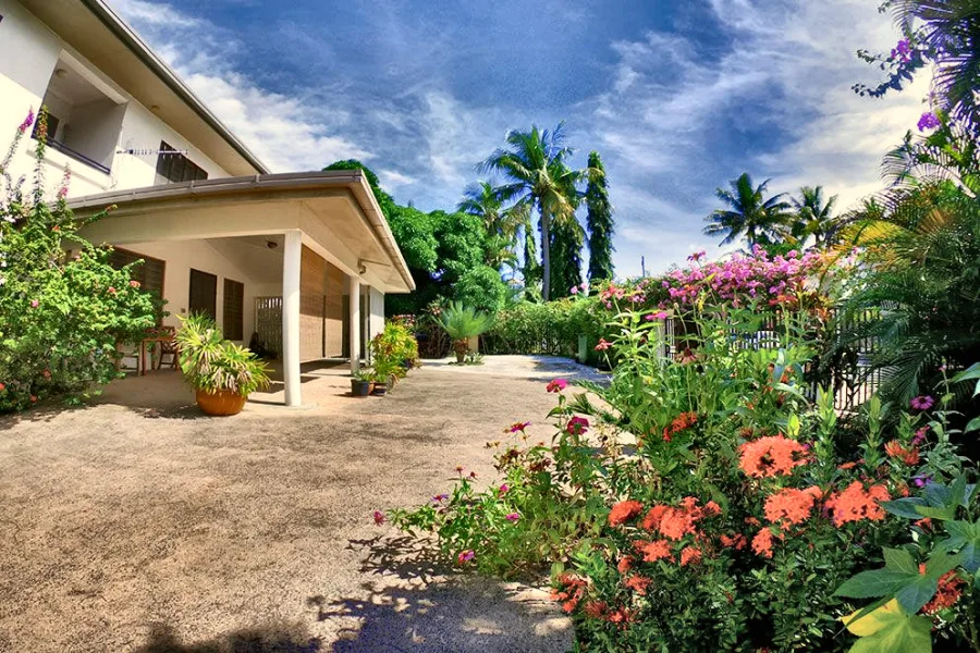 The driveway at Nadi Beach Apartments, with bougainvillea in flower