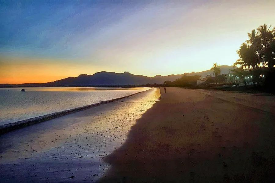 Wailoaloa Beach at sunset with the Sabeto mountains behind